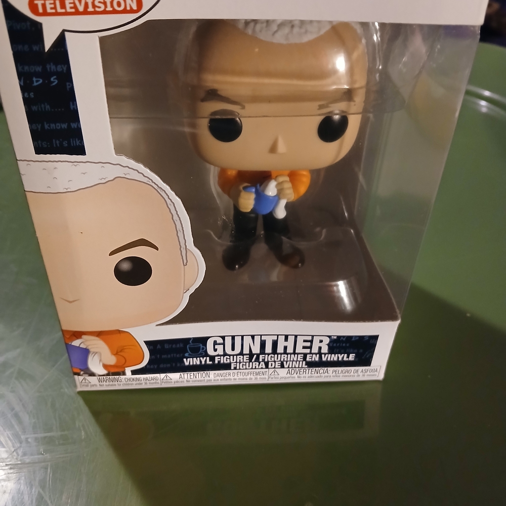 Funko Pop Gunther Figure with Orange and Blue